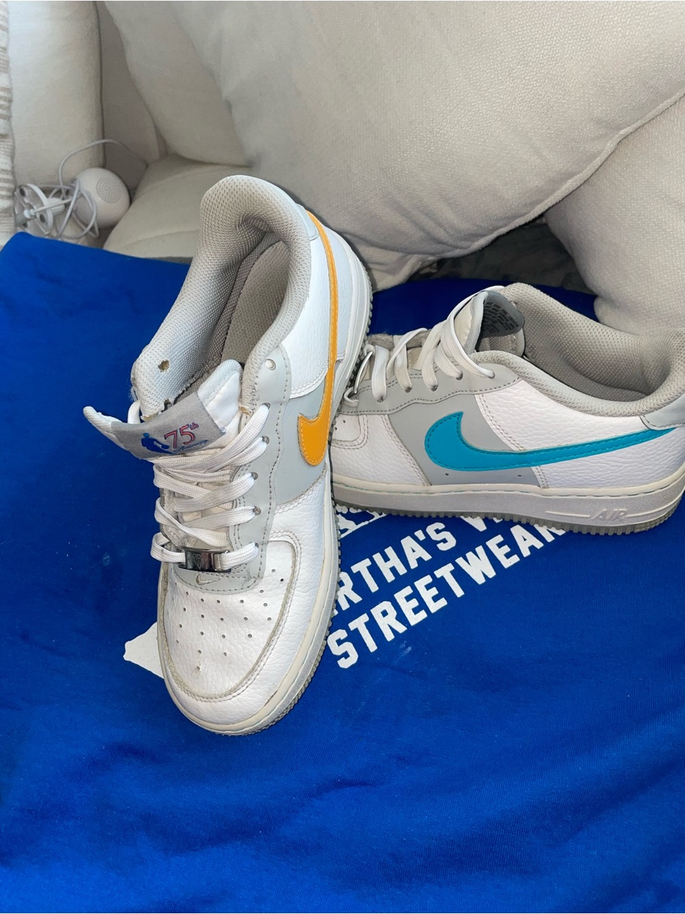 Nike White Low-Top Sneakers with Blue & Yellow Swooshes 75th anniversary
